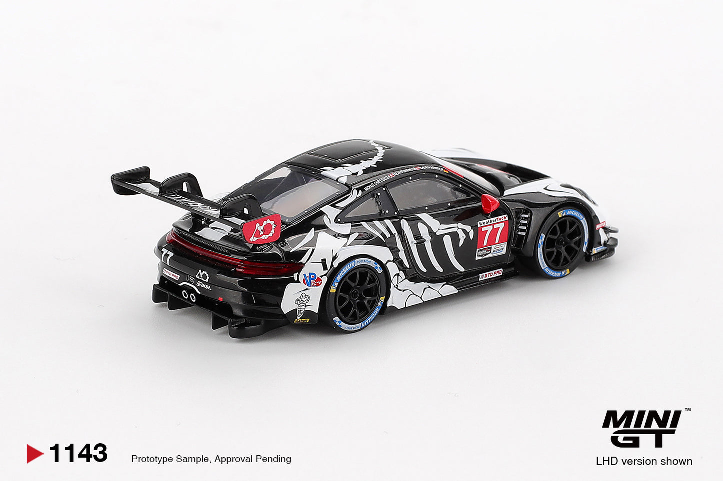 Mini GT #1143 - Porsche 911 GT3 R #77 AO Racing 2025 IMSA Petit Le Mans Skeleton Rexy BLISTER